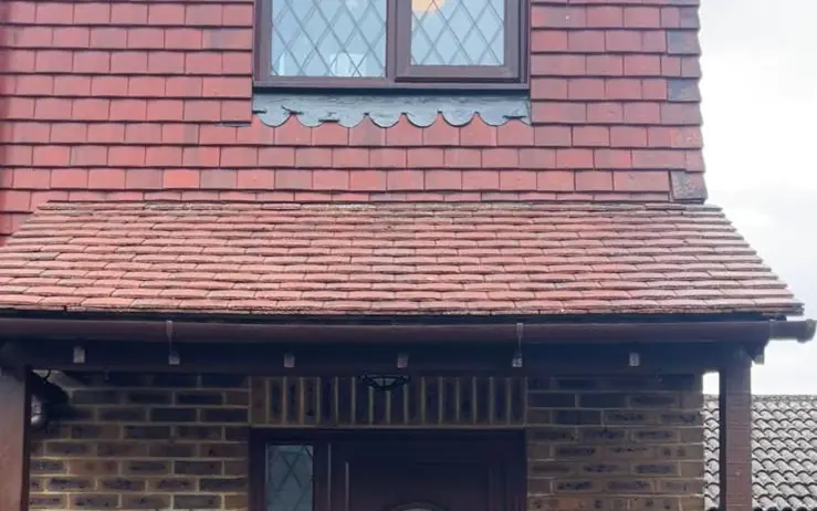 Porch roof, the moss cleaned off, one of our jobs