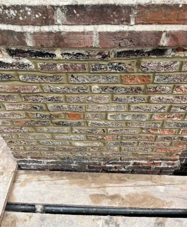 Chimney stack with fresh pointing on the lower courses