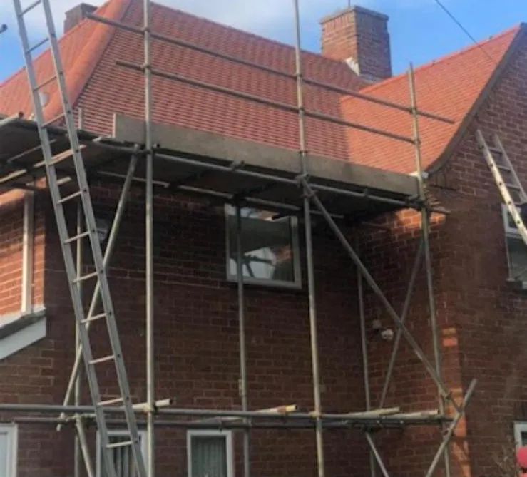 House fully scaffolded ahead of a re-roof