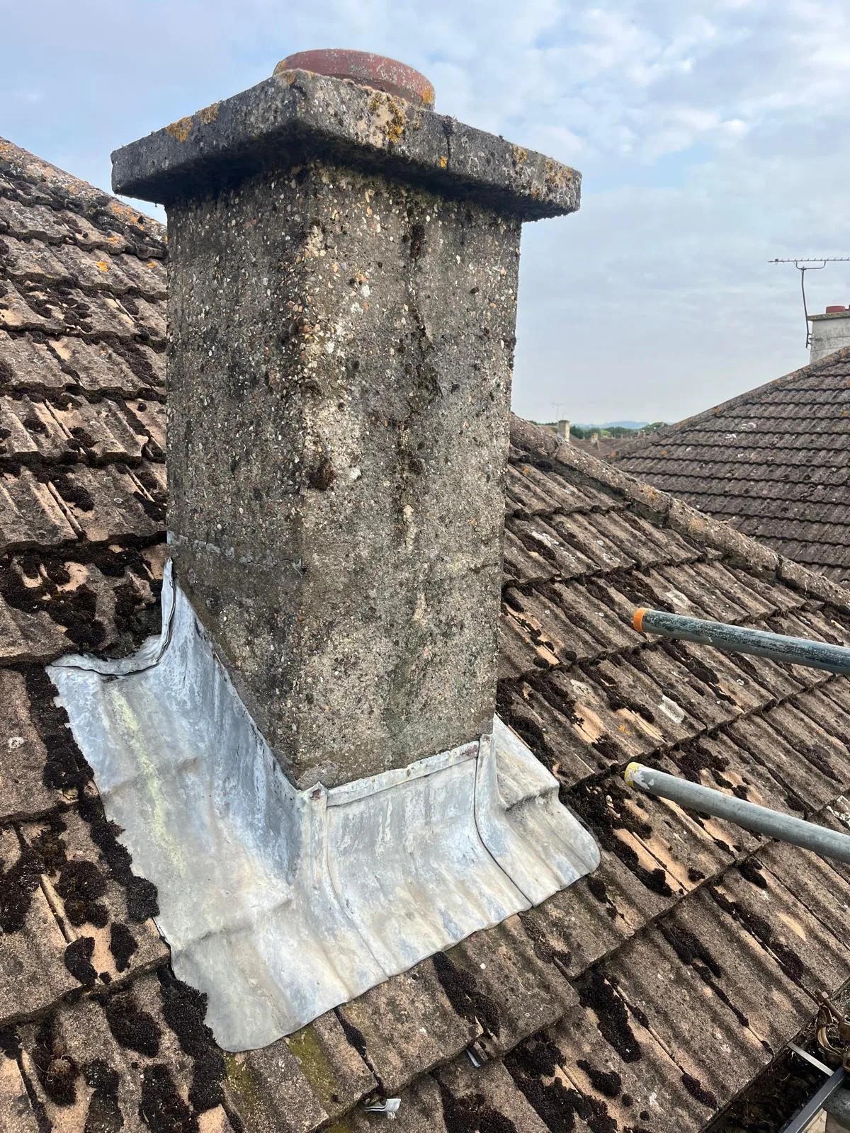 Chimney stack with new lead flashing dressed around the base